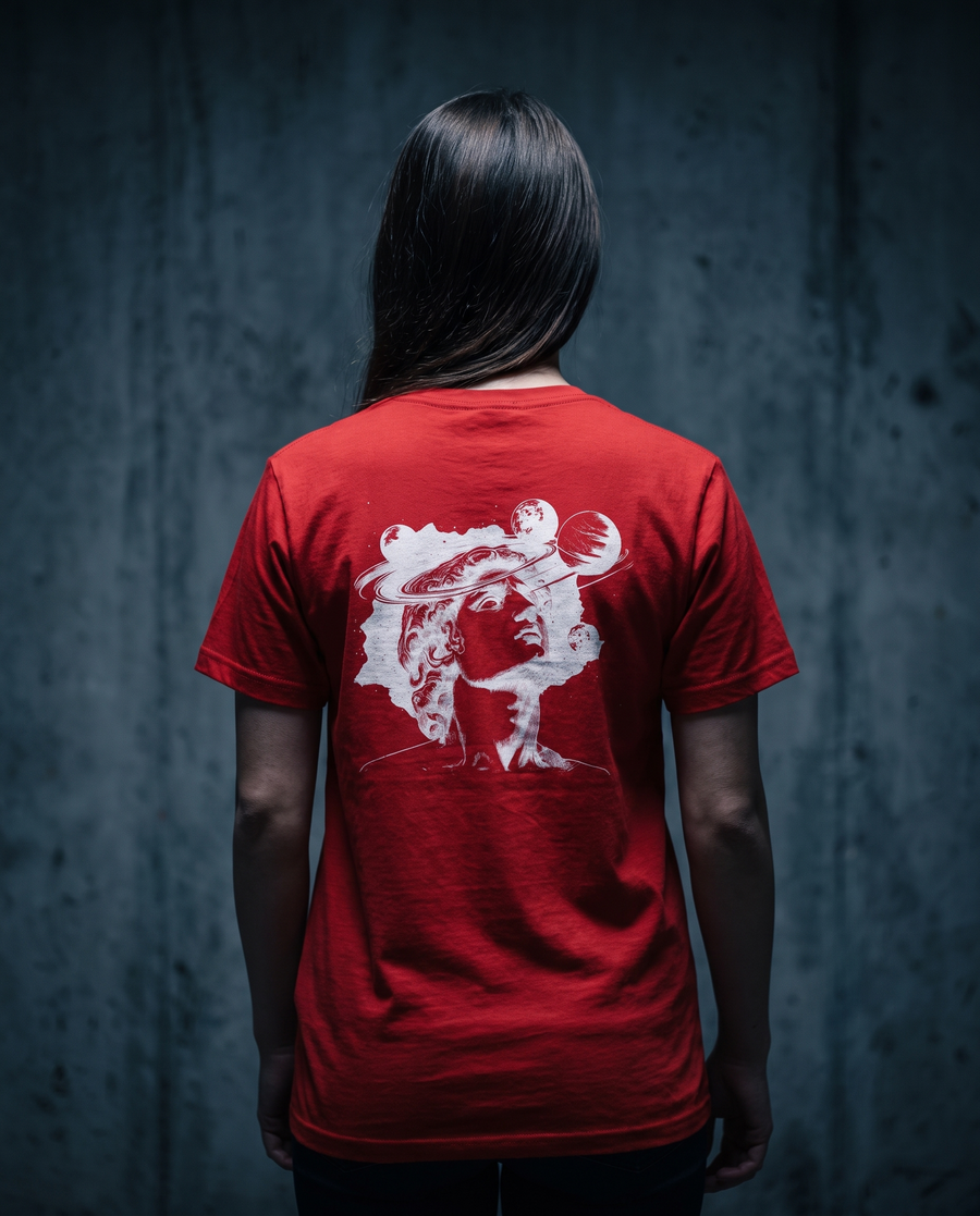 Model wearing BEXP Imagination t-shirt against a dark textured wall